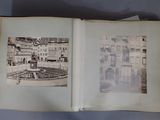 an open book with a picture of a building and a fountain