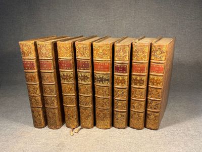a set of five books sitting on top of each other on a table