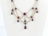 a close up of a necklace on a mannequin mannequin