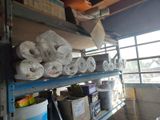 many rolls of toilet paper on the shelves in the room