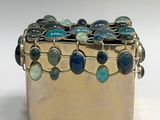 silver box with blue and green glass beads on it