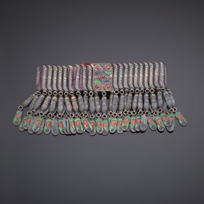 a close up of a bracelet with many different colored beads