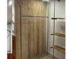 a picture of a room with a wooden wall and shelves