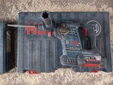 a cordless drill and a cordless hammer on the ground