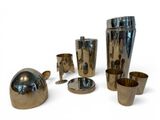 a lot of silver objects that are on a white surface