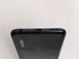 a close up of the back of a black cell phone