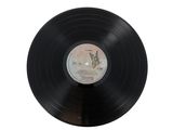 vinyl record with a picture of a rabbit on it on a white surface