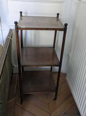 a wooden shelf with a shelf on top of it