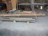 several pieces of wood are stacked on top of each other in a garage