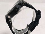 a close up of a watch on a clear stand
