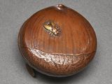a wooden box with a bee on it on a table