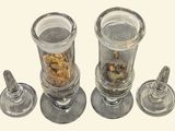 three glass jars with food in them sitting on a table