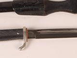 a knife and a knife holder on a table