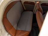 a view of a car ' s interior from the back seat