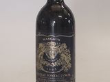 a bottle of wine that is sitting on a table