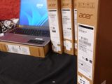 three laptops that are sitting on a table