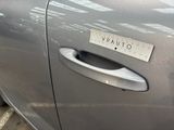 a close up of a car door handle with a sticker on it