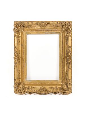 a gold frame with a white background and a white wall