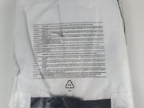 a bag with a piece of paper in it
