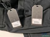 two tags attached to the back of a pair of pants