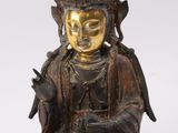 an image of a statue of a buddha sitting on a white surface