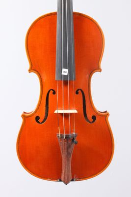 a close up of a violin with a bow on a white background