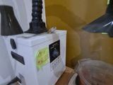a cake sitting on top of a microwave on a table