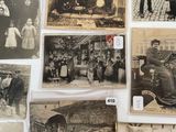several old black and white photographs of people and animals on a wall