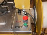 a picture of a machine that is working on a piece of paper