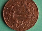 a close up of a penny on a green surface with a green background