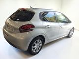 a picture of a silver car parked in a white room