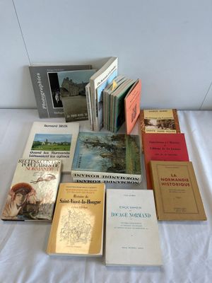 a lot of books that are on a bed