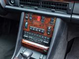 a dashboard of a car with a wooden panel