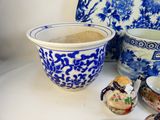 a blue and white vase and a bowl on a table