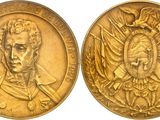 two gold medals depicting a man and a woman