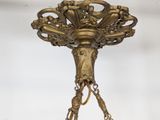a gold chandelier hanging from the ceiling