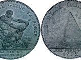 a silver coin with an image of a man holding a sword