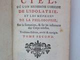 an open book with a picture of a castle on the cover