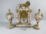 a statue of a lion on top of a table next to three vases