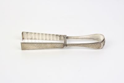 a knife that is sitting on top of a white table