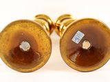 pair of gold plated cufflinks with brown and white glass