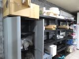 a refrigerator in a room with a lot of items on the shelves