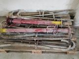 a pile of tools sitting on a pallet in a room