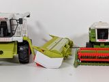 two toy tractors that are sitting next to each other