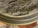 a close up of a bronze statue of a man