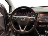 dashboard of a car with a steering wheel and dashboard controls