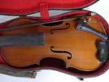 a violin in a case with a bow in it