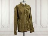 an image of a green shirt on a mannequin stand