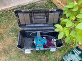 a tool box that is sitting in the grass