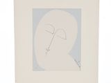 une image représentant le dessin du visage d'un homme sur une feuille de papier